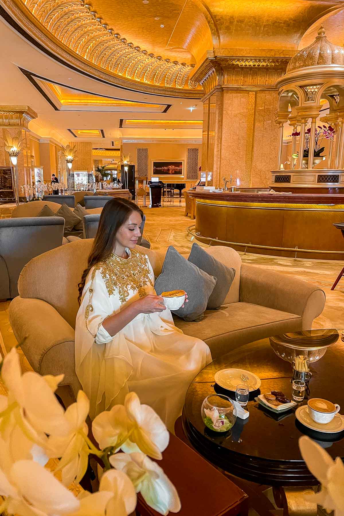 Girl drinking a Gold cappuccino at Emirates Palace, Abu Dhabi