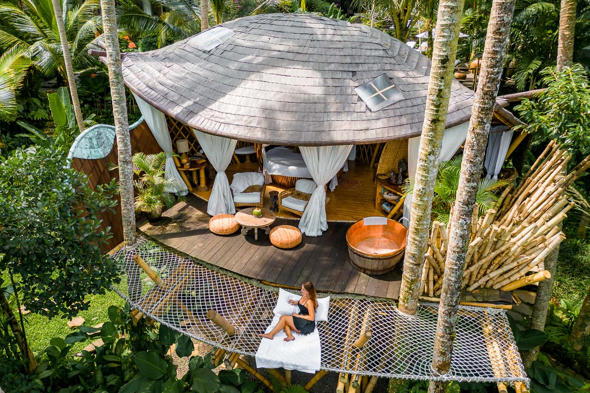 Girl on a hanging net at the Treehouse at Stone House Bali