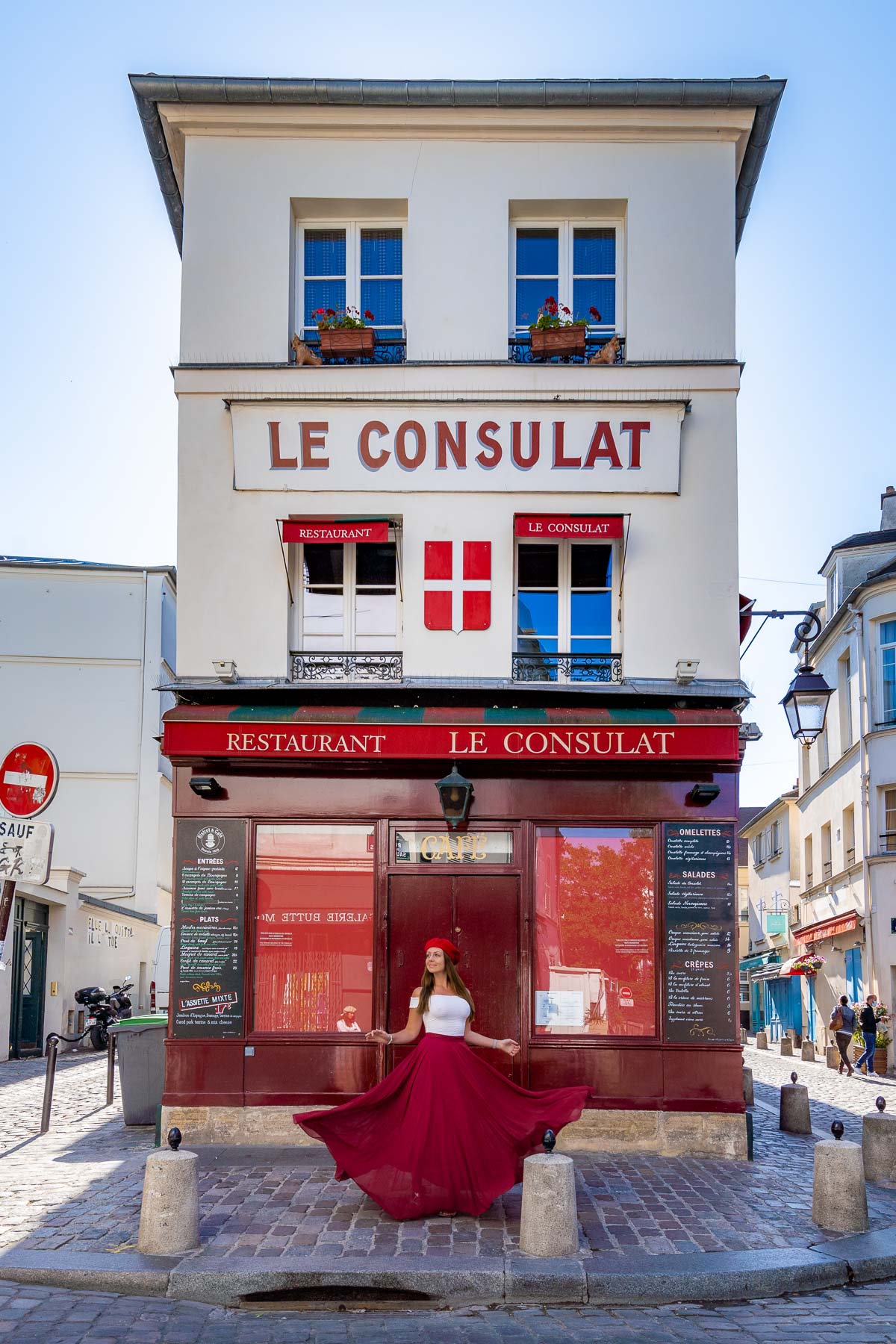 Girl in front of Le Consulat, Paris