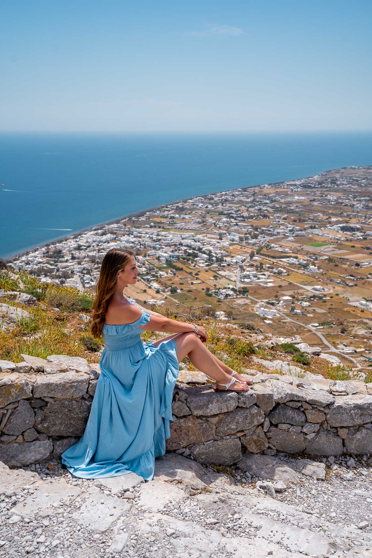 Girl at Ancient Thira overlooking the coast of Santorini
