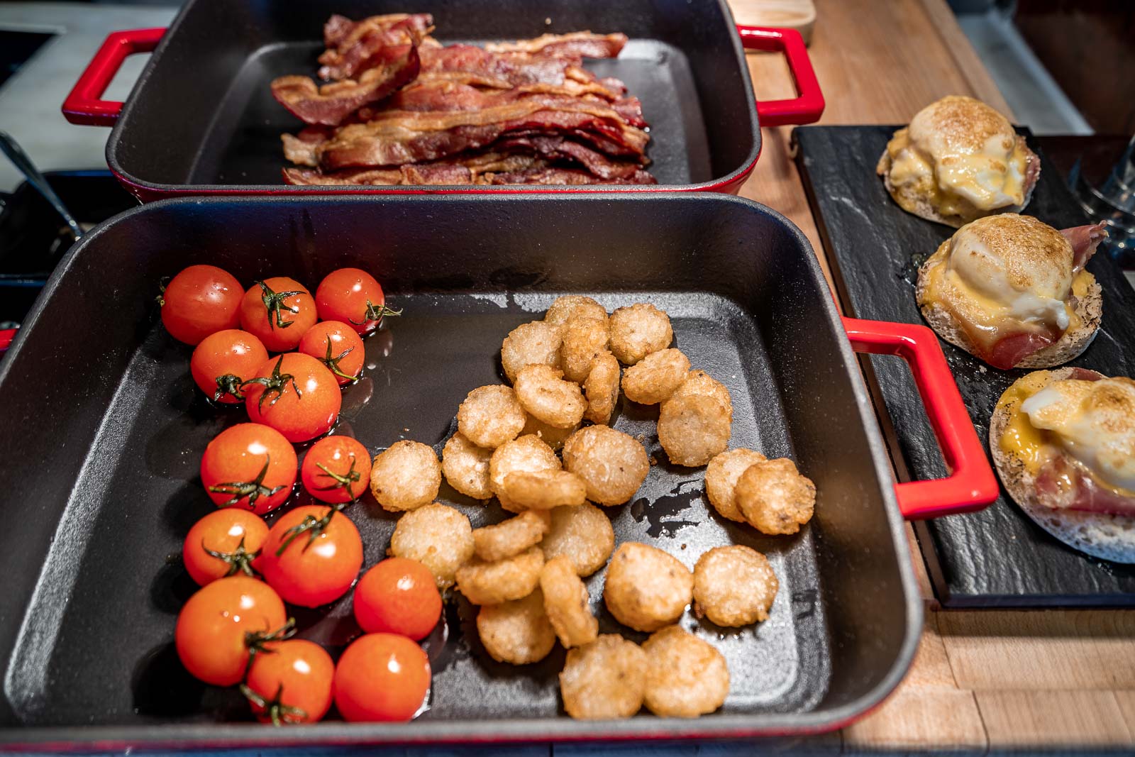Fried potatos, tomatoes and bacon slices for breakfast