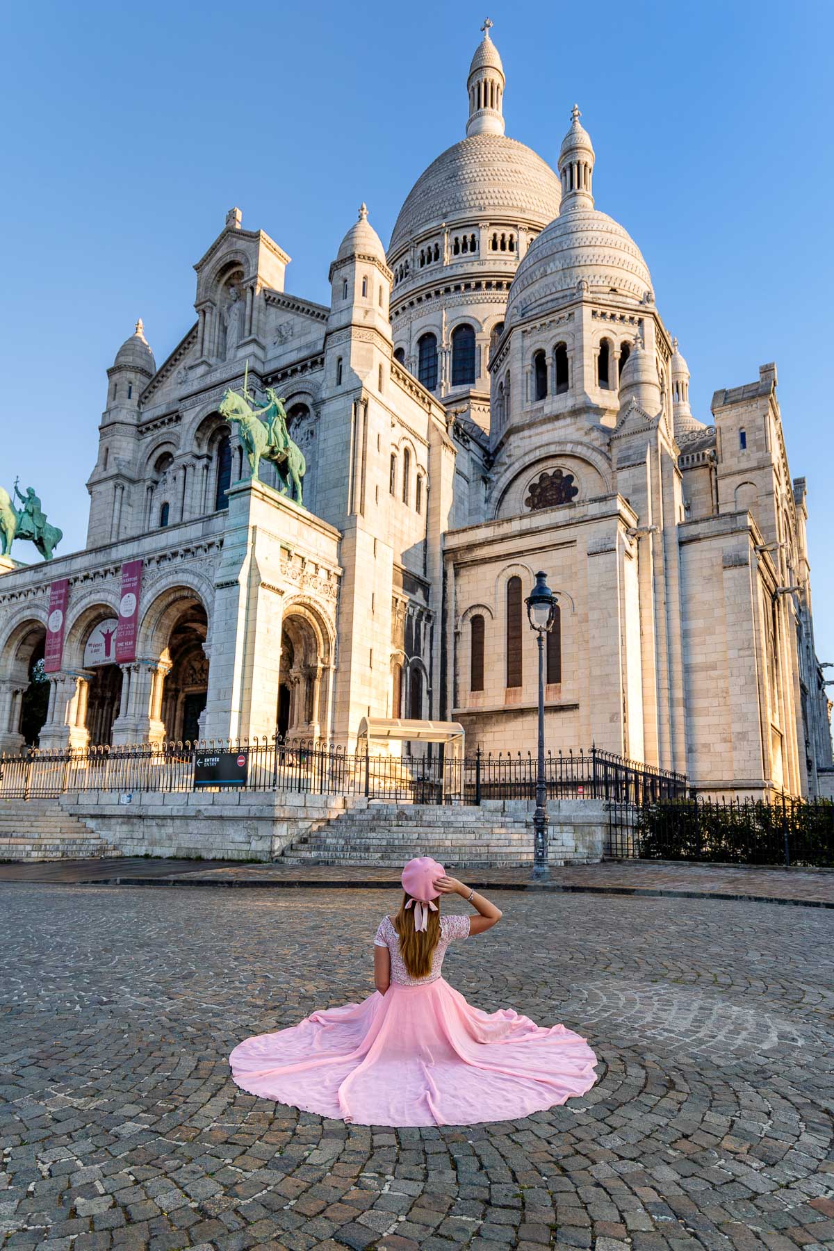 Girl in front of the Sacre-Coeur Basilica in Paris