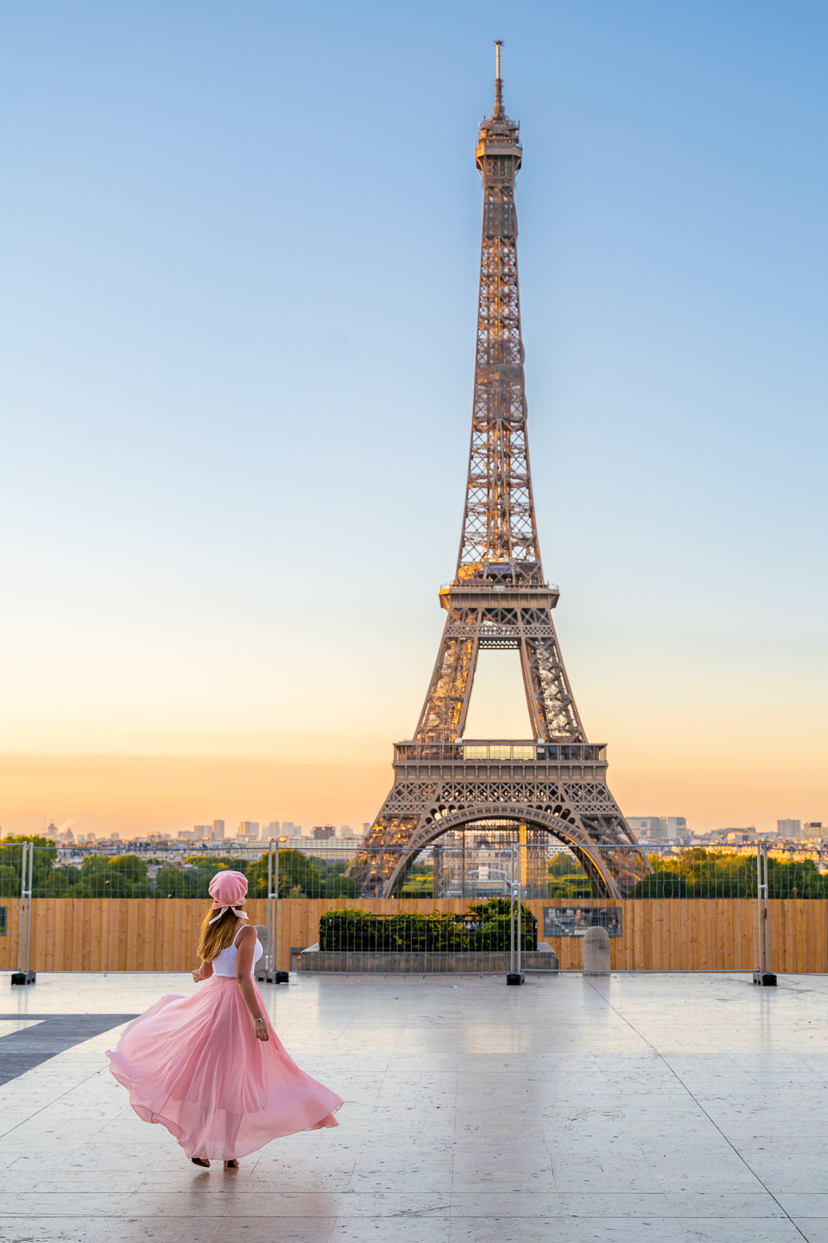 Girl in a pink skirt in front of the Eiffel Tower at Trocadero, Paris