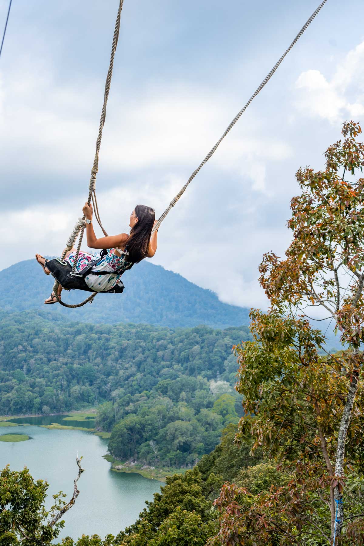 Girl swinging at Wanagiri Hidden Hills in Bali