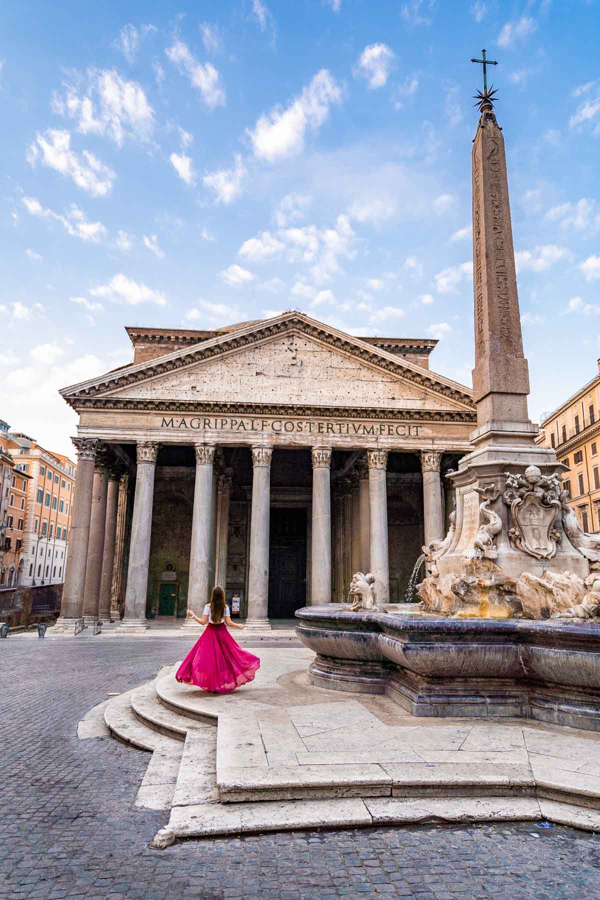 Girl in a pink skirt in front of the Pantheon in Rome, Italy