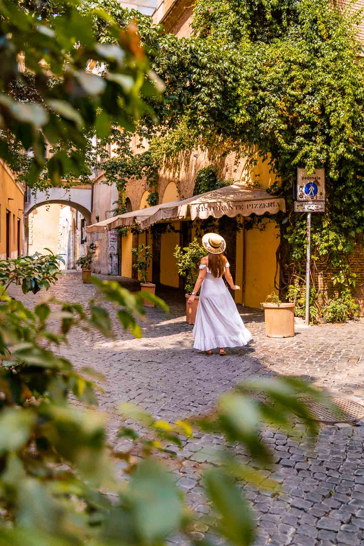 Girl in a white dress in the Trastevere neighborhood in Rome, Italy