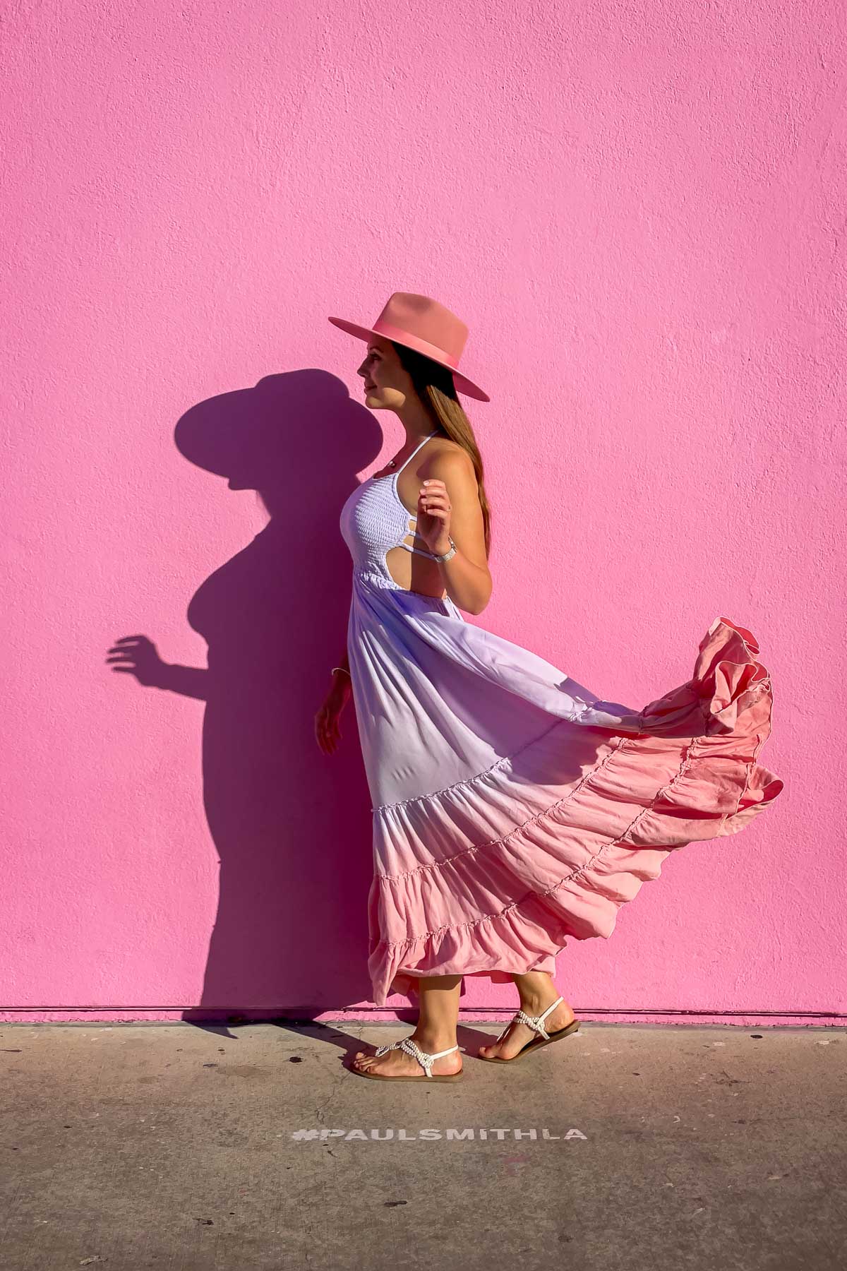 Girl in front of The Pink Wall at Paul Smith in Los Angeles