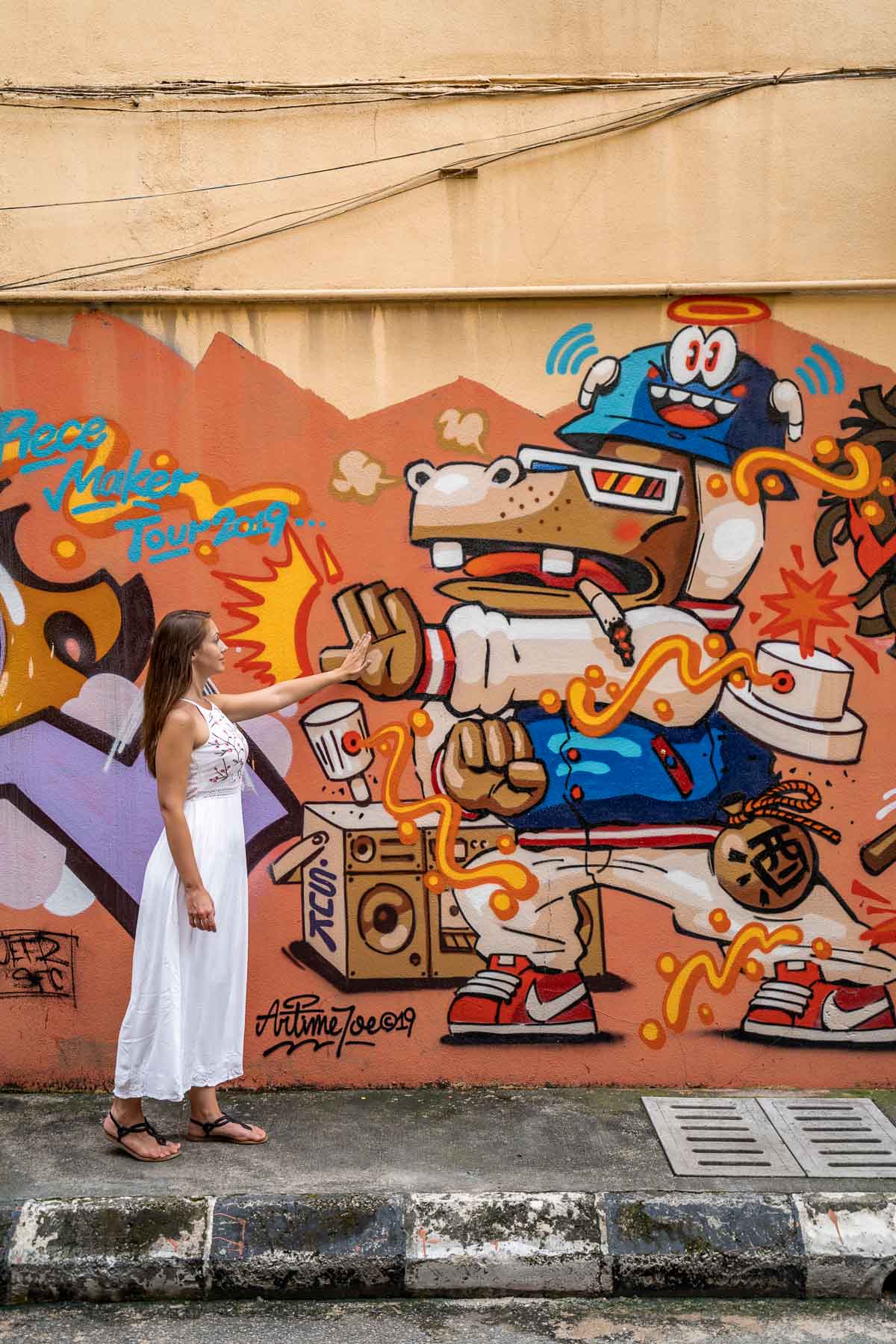 Colorful street art in Kuala Lumpur with girl