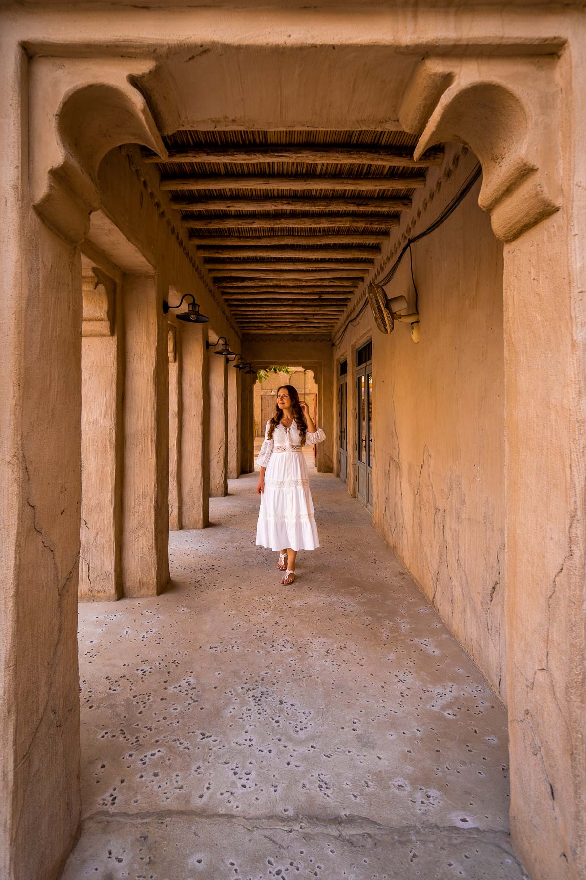 Girl under an archway in Old Town Dubai