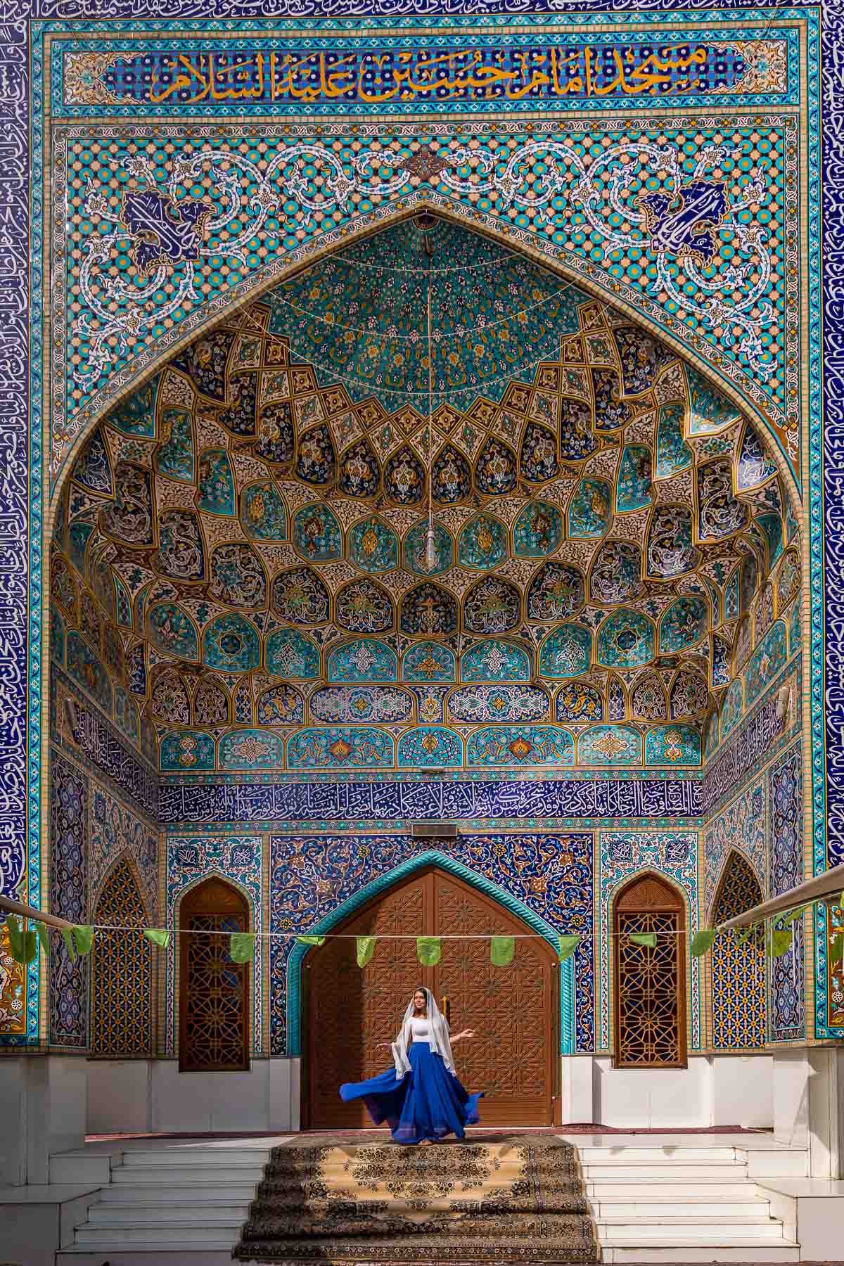 Girl in blue skirt at Imam Hussein Mosque in Dubai