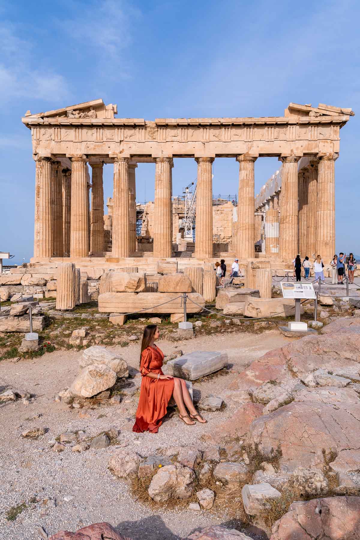Girl sitting in front of the Partheon, one of the best Instagram spots in Athens