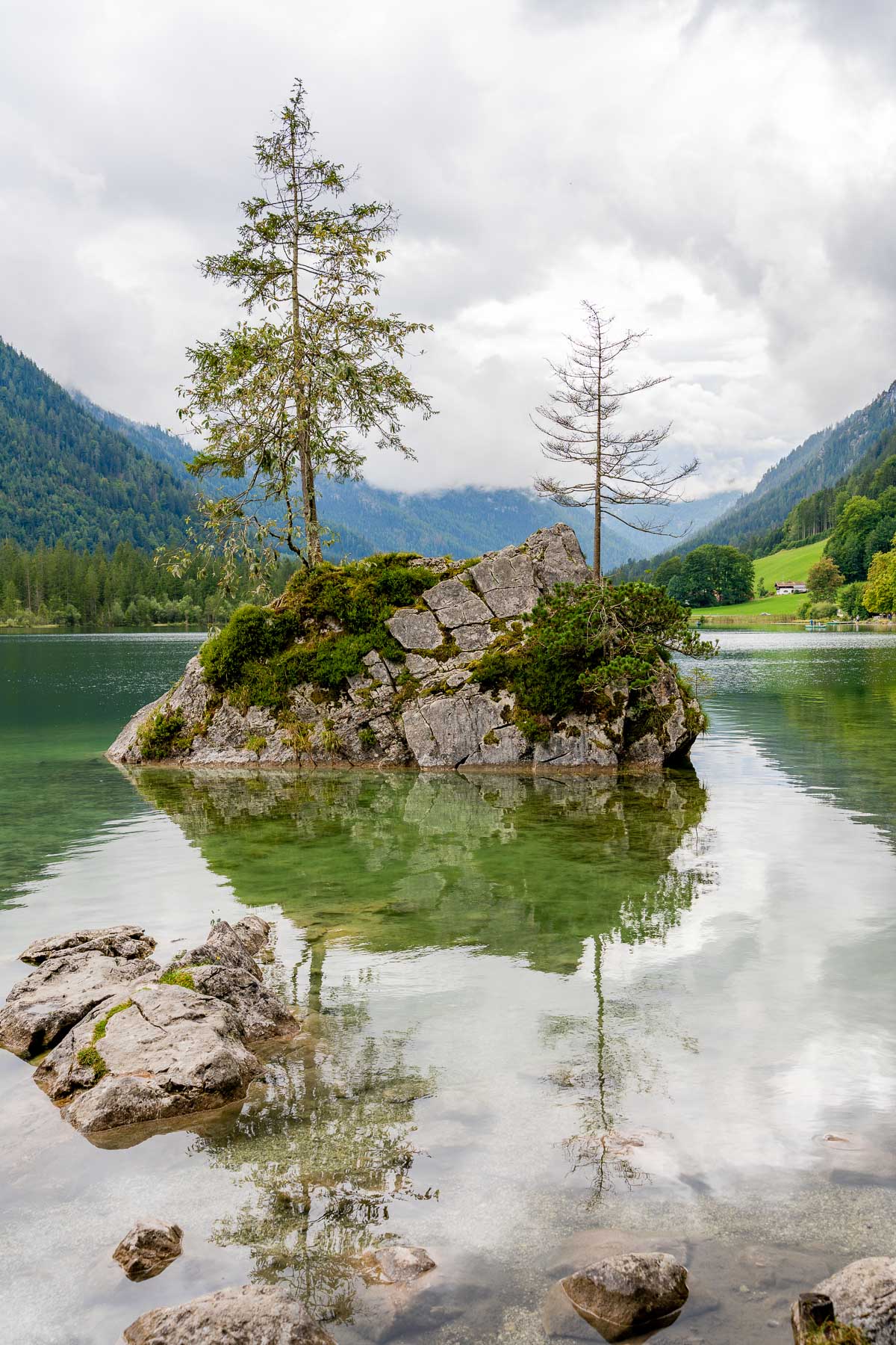 Rock island in the water at Hintersee, Germany