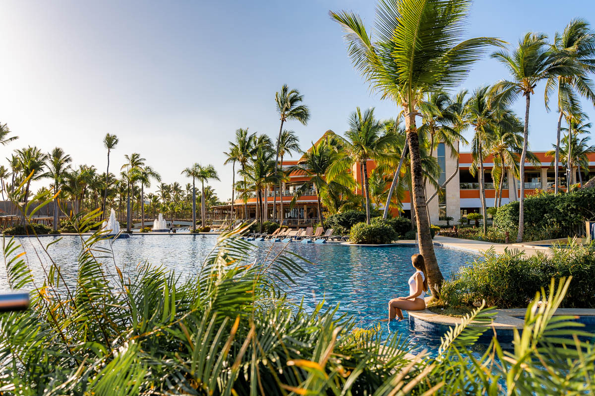 Girl sitting on the edge of the pool at Barcelo Bavaro Palace