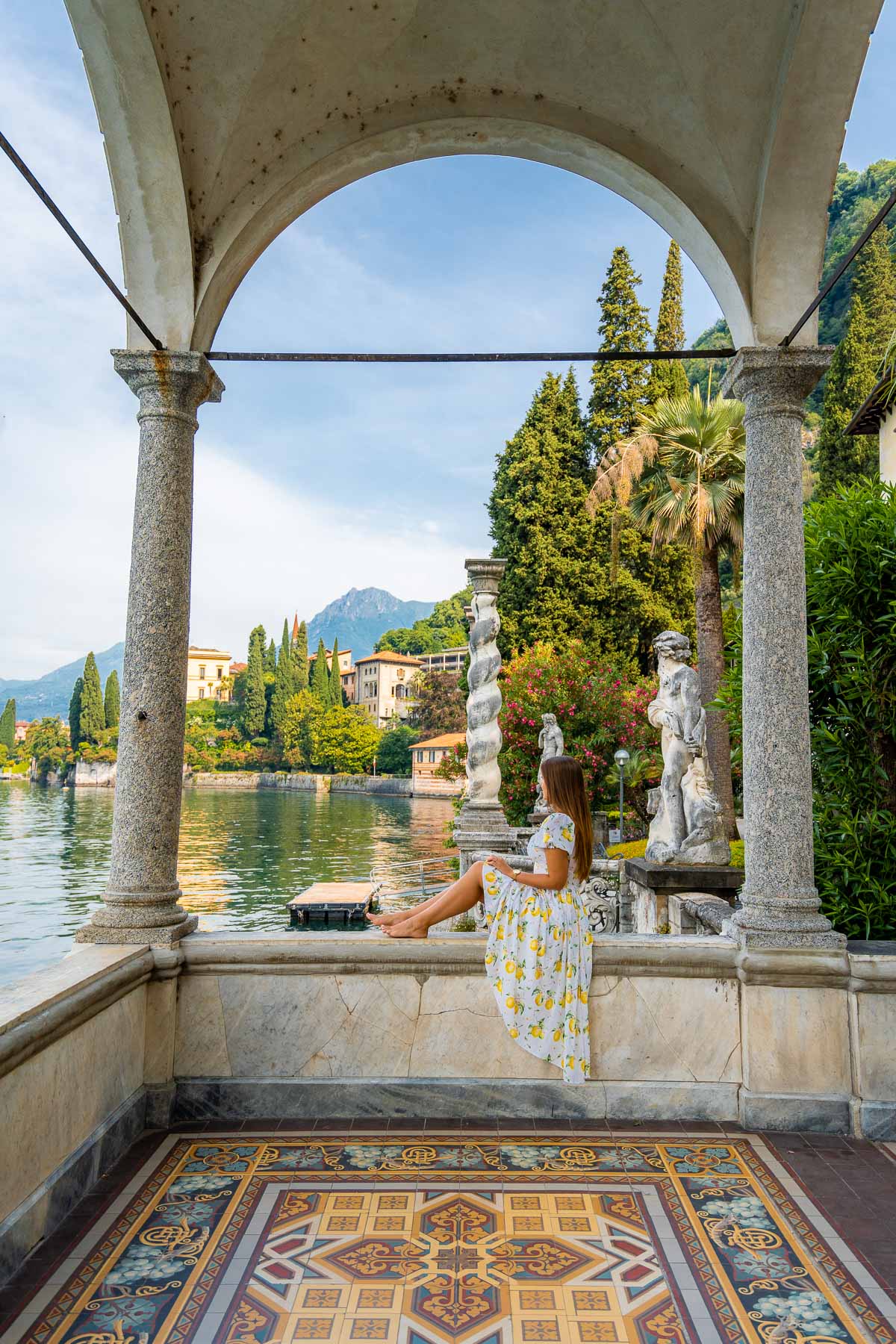 Girl sitting in an archway at Villa Monastero in Varenna, Lake Como