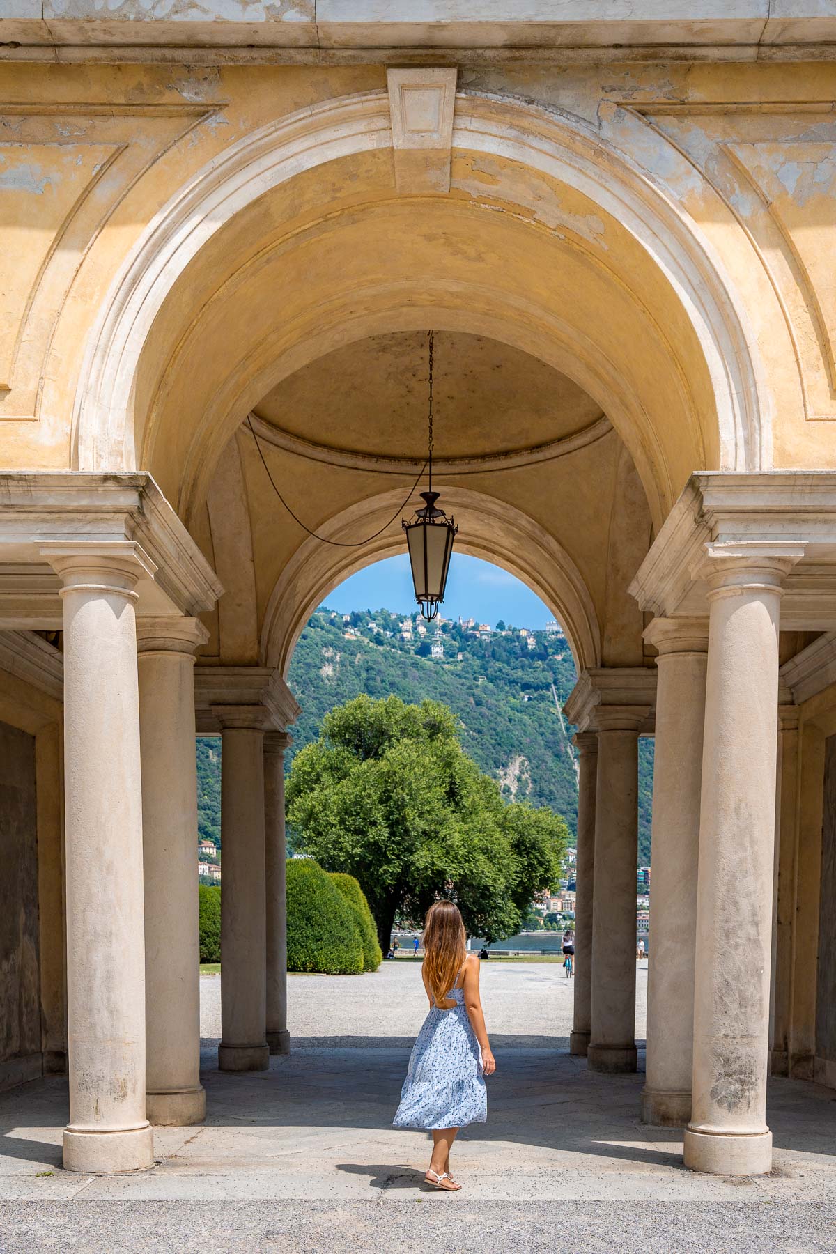 Girl under an archway at Villa Olmo, Lake Como