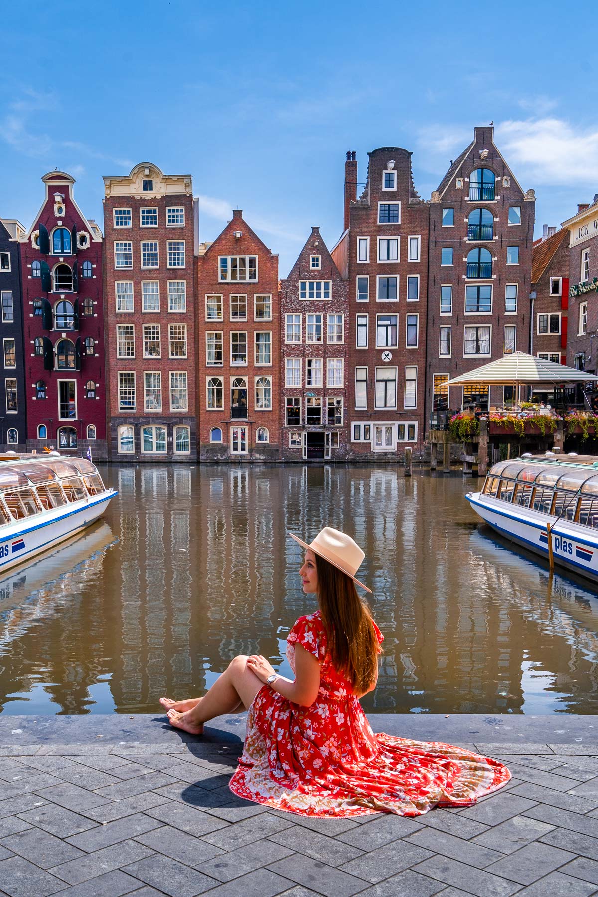 Girl at the Damrak Canal Houses Amsterdam