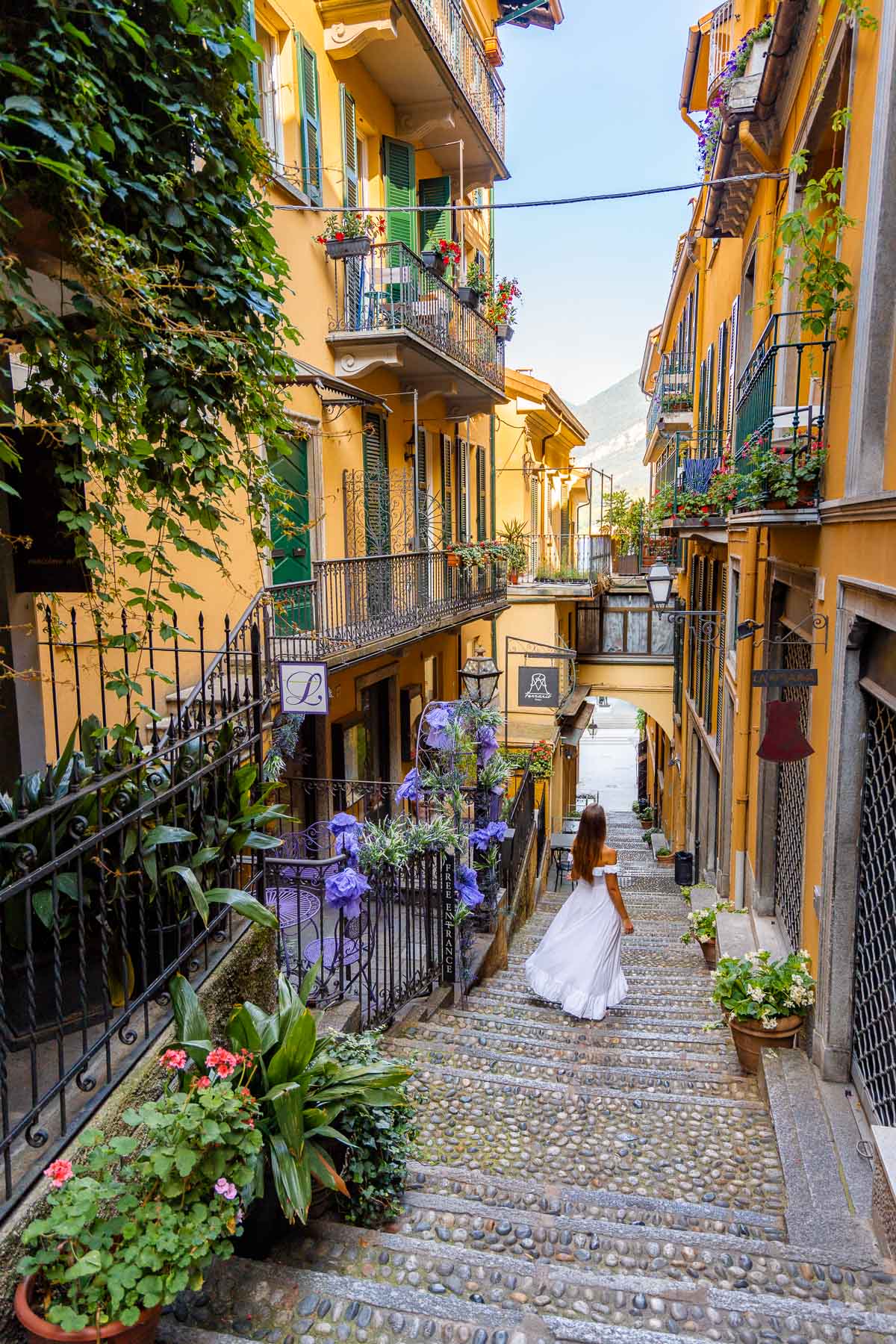 Girl in white dress on the streets on Bellagio, Italy