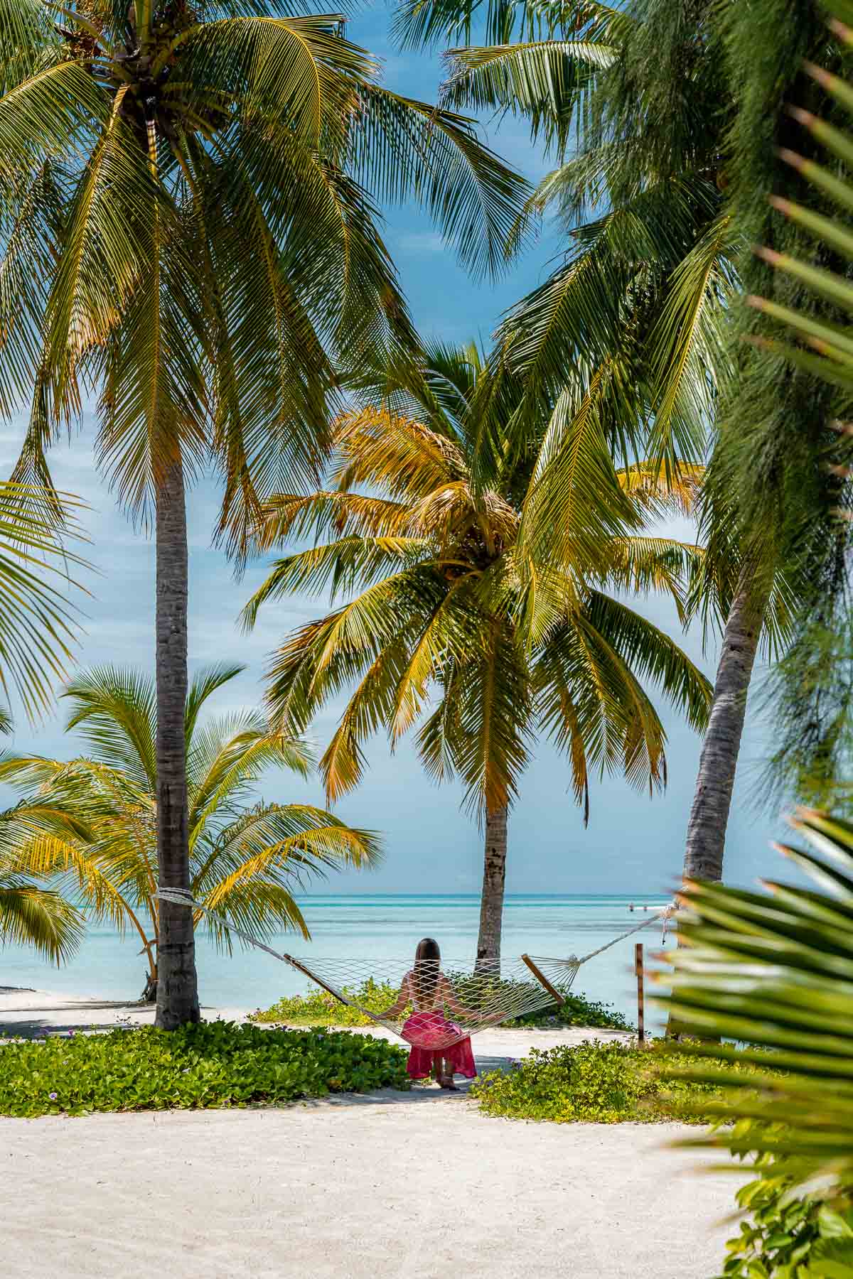 Girl in a hammock at the Beach at Cinnamon Hakuraa Huraa Maldives