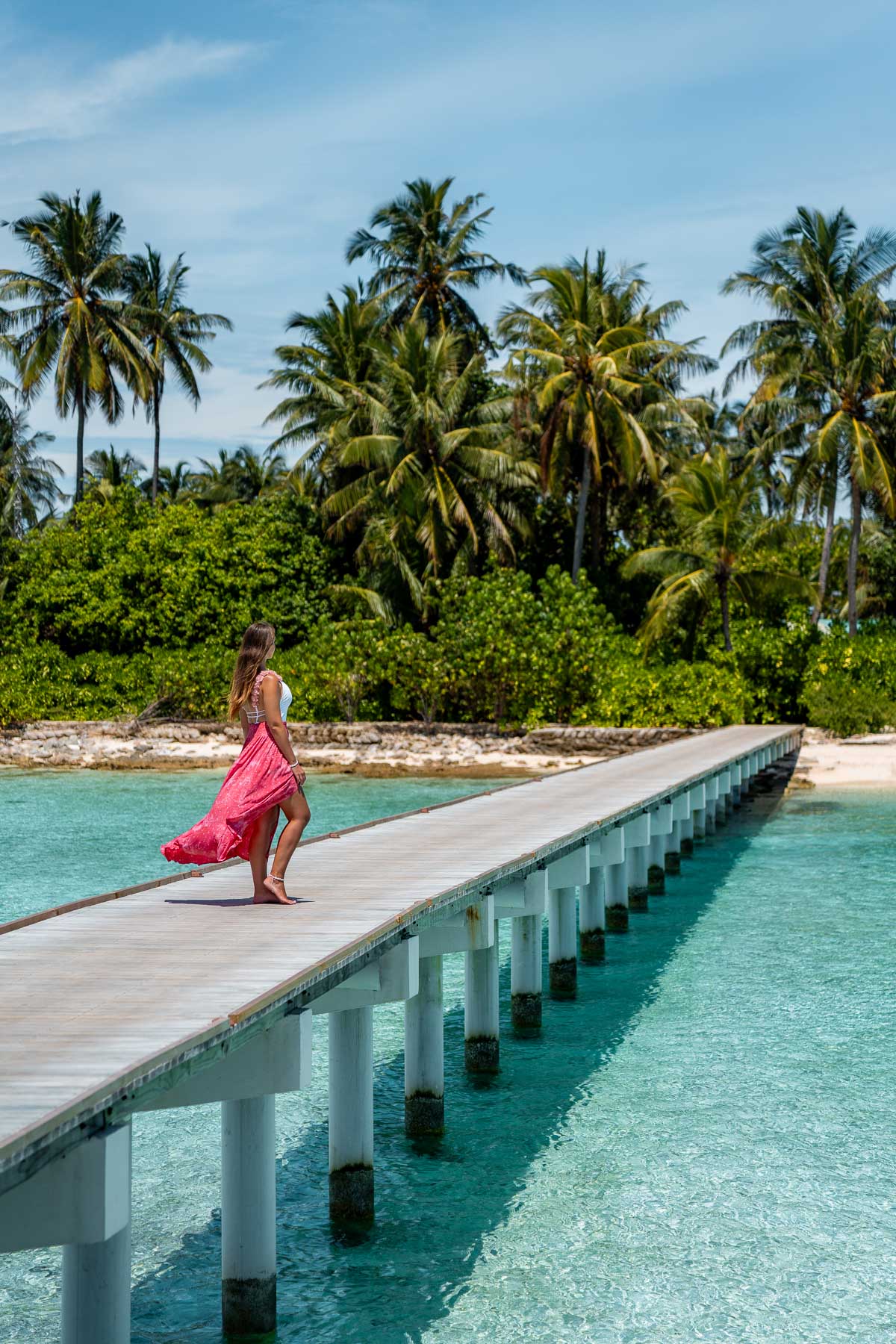 Girl on a walkway at Cinnamon Hakuraa Huraa Maldives