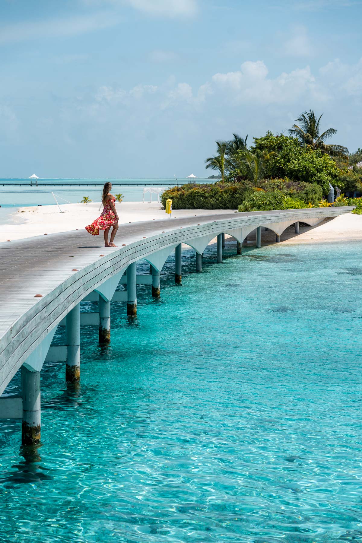 Girl on the walkway at Cinnamon Hakuraa Huraa Maldives