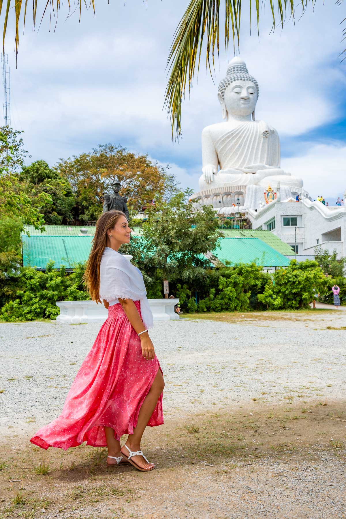 Girl in front of the Big Buddha in Phuket, Thailand