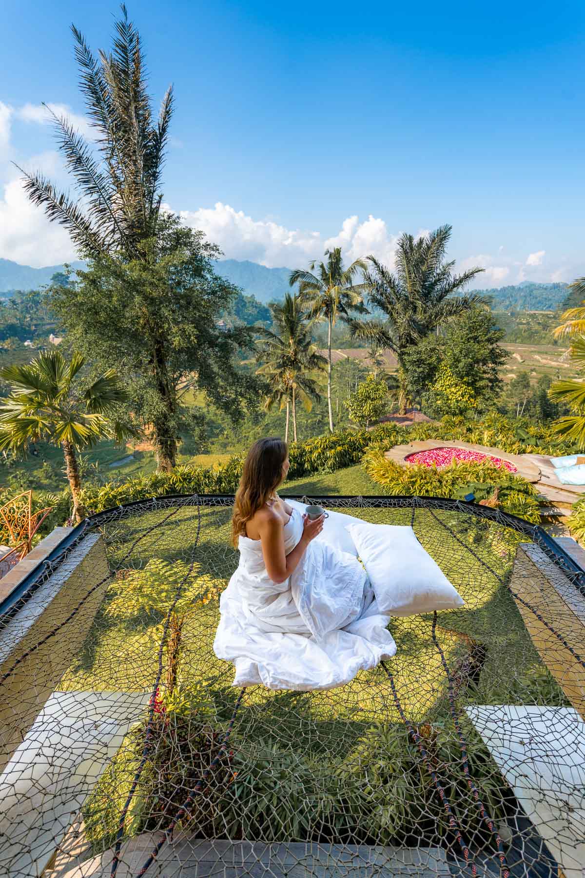 Girl on a hanging net at Magic Hills Bali
