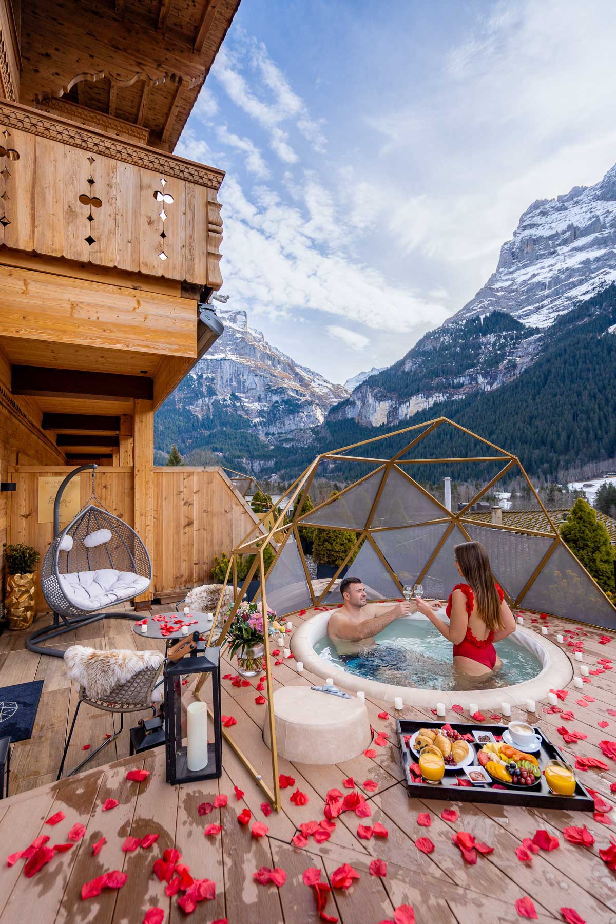 Couple in the hot tub at Signature Room Sunset at Boutique Hotel Glacier