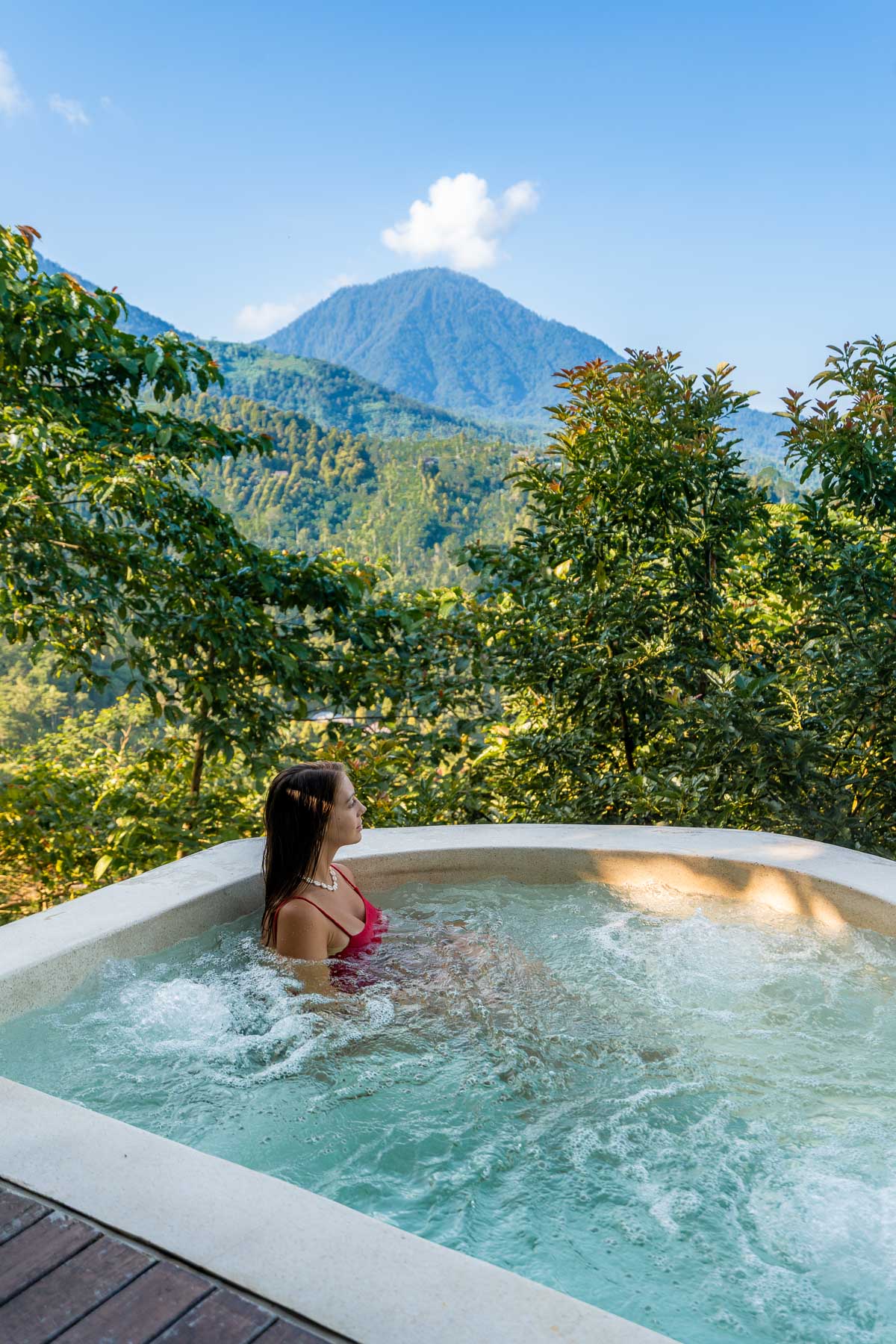 Girl in a hot tub at the Volcano Panorama Villa at Elevate Bali