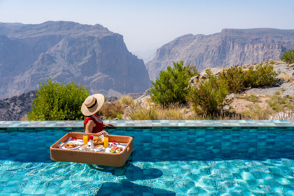 Girl with a floating breakfast at Anantara Al Jabal al Akhdar Resort