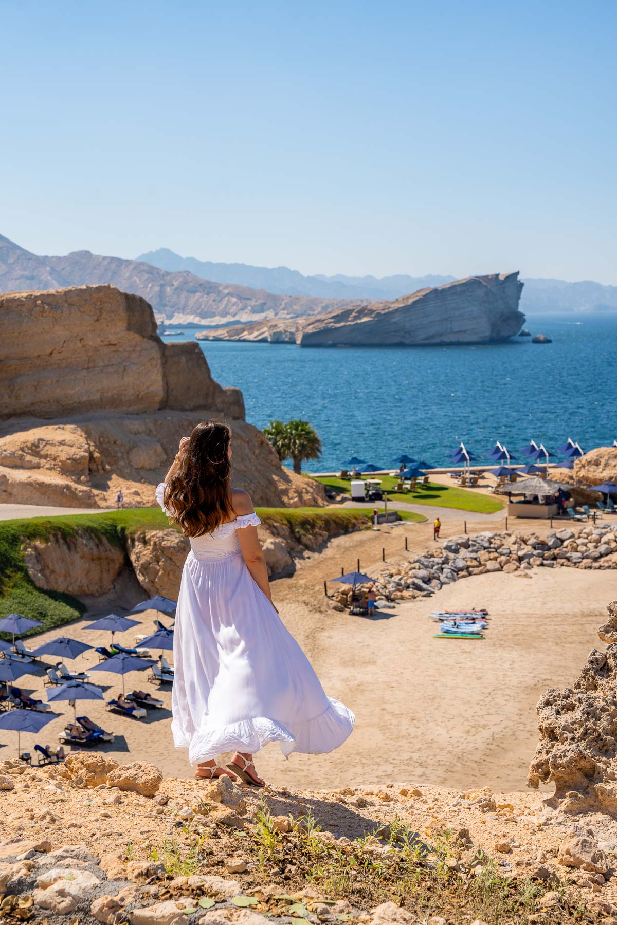 Girl overlooking the private beach at Shangri-La Al Husn