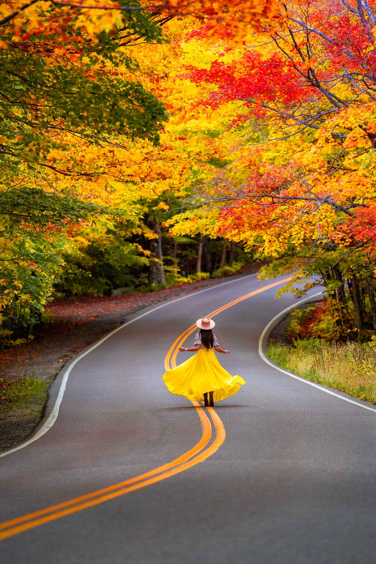 Girl on the road at Smuggler's Notch in the fall