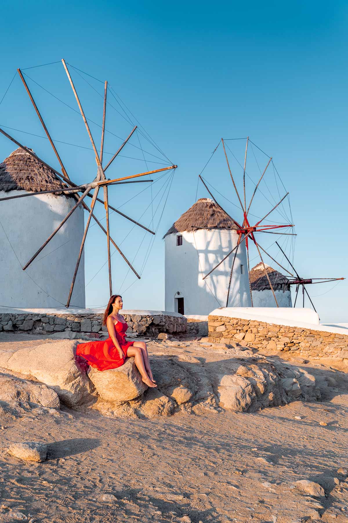 Girl in front of the windmills in Mykonos