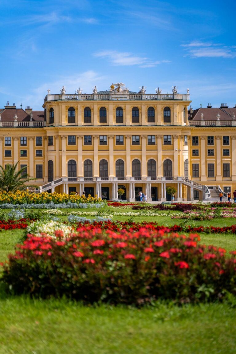 Schonbrunn Palace with flowers in the foreground in Vienna, Austria