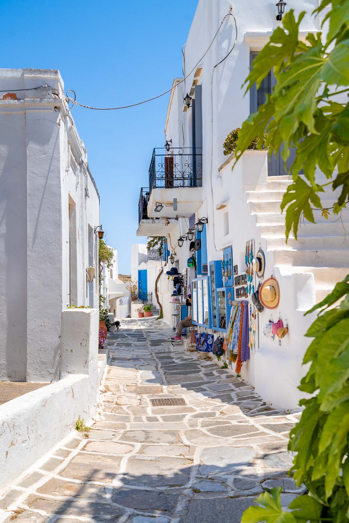 The charming streets of Lefkes, Paros, are lined with whitewashed houses, colorful shutters, and small shops offering local crafts and souvenirs.